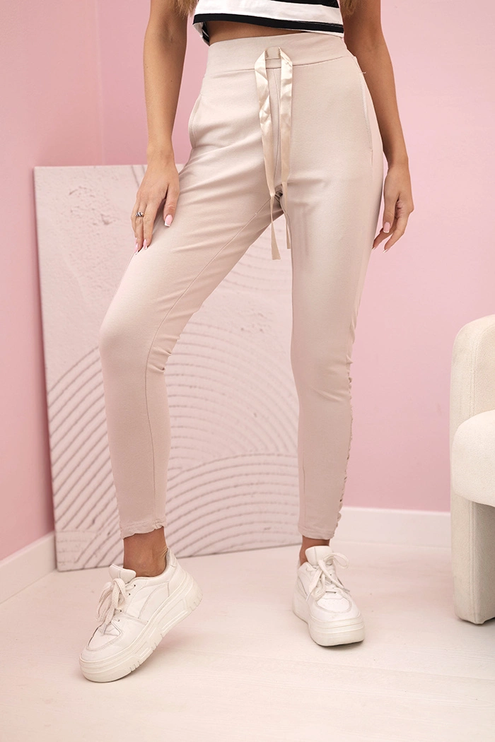 Kesi Dámské kalhoty s volánem na bocích béžové